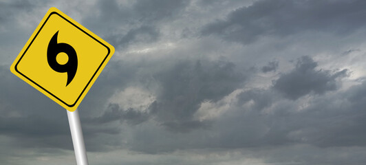 danger,caution,Hurricane Idalia warning sign against a powerful stormy background with copy space. Dirty and angled sign with cyclonic winds add to the drama.hurricane season sign on cloudy background