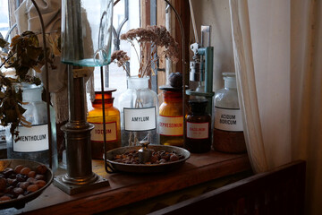 Old bottles with medications and chemicals substances in pharmacy