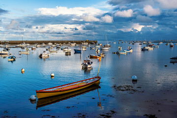 Small boats on the beach at low tide