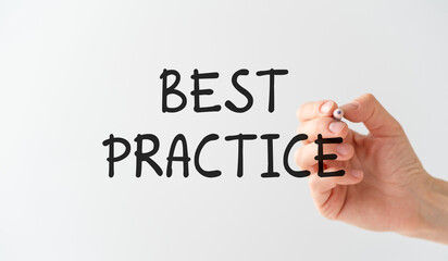 The hand of a business woman with a pen in her hands writes on a transparent background Best Practice