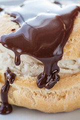 Close up of Choux pastry with ice cream and chocolate sauce