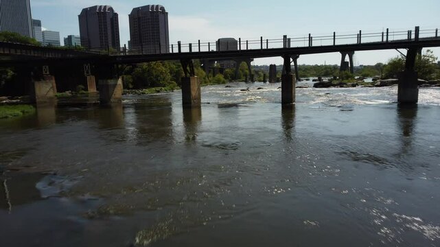 Flight with James river rapids under potter field bridge