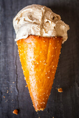 delicious ice cream in pretzel cone
