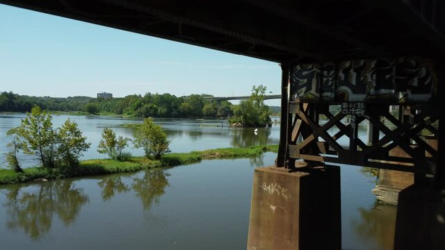 Fly under railway towards Belle Isle drone footage
