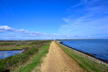 Footpath along The Solent Way trail at Lymington Hampshire England on a sunny Autumn  day