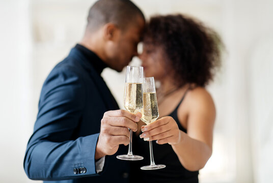 Close up of cheerful african american couple toasting with white wine, celebrating anniversary. High quality photo - Powered by Adobe