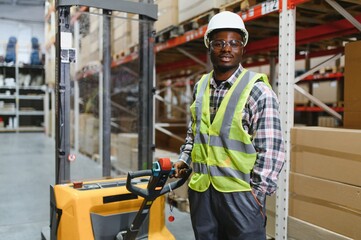 african american Storehouse manager supervising the lift truck operator