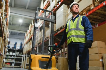 Man Driving Fork Lift Truck In Warehouse