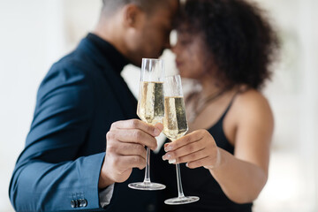 Cheers. Cropped of afro couple celebrating St. Valentine's Day at restaurant, drinking white wine. High quality photo