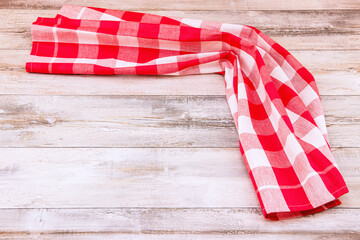 Food recipe template. Red white checkered tablecloth or napkin on bright rustic wooden table. Template for menu card and chalkboard. Space for product montage.