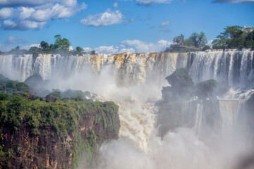Fototapeta premium Panoramic view of Iguazu Falls on a sunny day, Misiones, Argentina