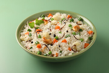 Indian veg biryani, veg pulav, Indian vegetable pulav, Biriyani, vegetable Biriyani served in a ceramic bowl