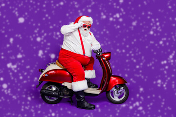 Full body photo of santa claus man came newyear party by bike stop in stupor few people wear sun...