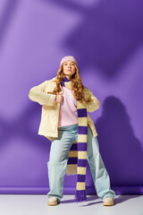 A young beautiful plus size woman stands confidently, showcasing her unique winter fashion style.