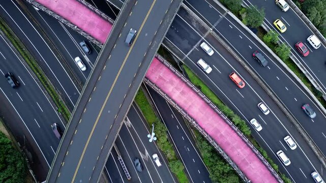 Auckland, New Zealand: Upward top down aerial drone footage of the traffic on highway junction in Auckland, New Zealand largest city. 
