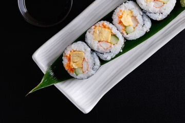 Futomaki maki rolls Japanese food isolate in black background