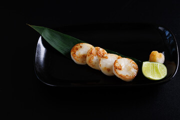 Grilled Japanese scallop grilled scallops Japanese Seafood Hokkaido japan Isolate in black background