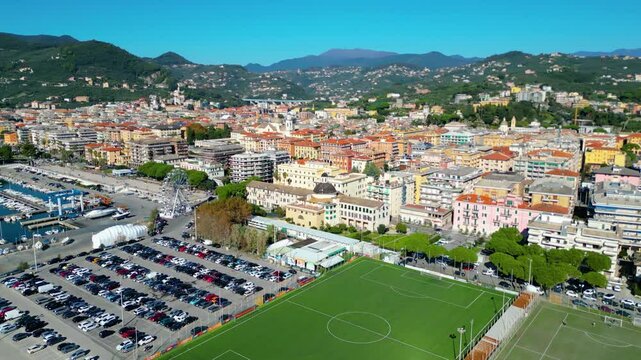 Chiavari, a charming coastal town in Italy's Liguria region, viewed from the air showcases its scenic waterfront, vibrant marina, and historic architecture nestled between the green hills