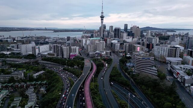 Auckland, New Zealand: Aerial drone footage of the traffic that rush on highway junction in Auckland with downtown district in New Zealand largest city. 