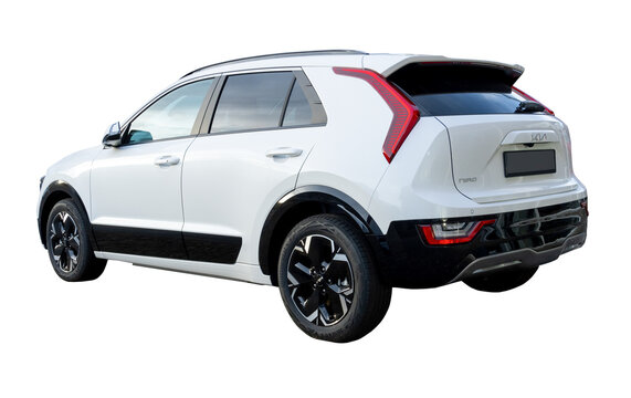 Rear side view of a white Kia Niro II battery-electric crossover car. PNG