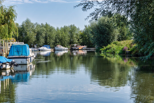 Boats on the Great Stour river at Stodmarsh near Canterbury in Kent, England