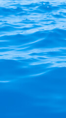 gentle ripples on a blue water surface