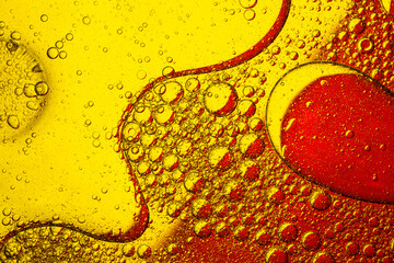 Yellow and red bubbles macro,creative abstract orange and red color background from mixed water and oil