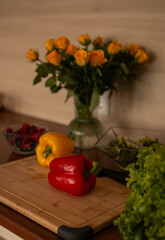A wooden kitchen counter with fresh vegetables