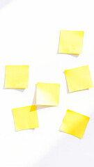 six yellow sticky notes on a white surface