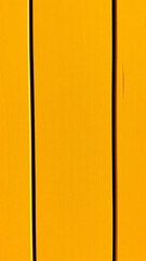 bright yellow textured surface with vertical lines