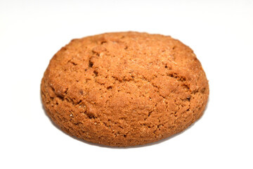 Round shaped oatmeal cookies lie on a white background.