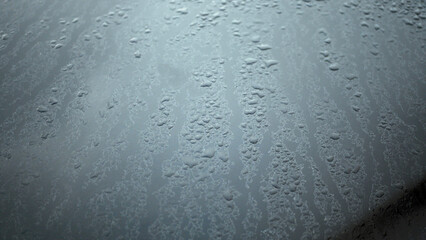 Foggy car glass early in the morning, smudges and drops of water, autumn, cold, weather, France, Europe