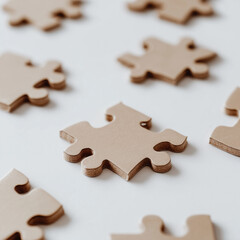 Blank puzzle pieces scattered on table