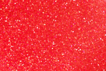 Bright blurred abstract red background with shimmering glitter