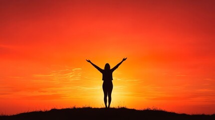 Silhouette of a Woman Against a Vibrant Sunset Sky