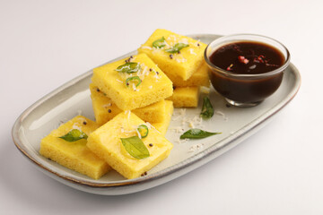 Dhokla, savoury sponge dish that is native to the Indian state of Gujarat and parts of adjacent...