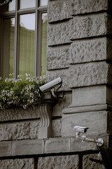 A security camera mounted on a wall.