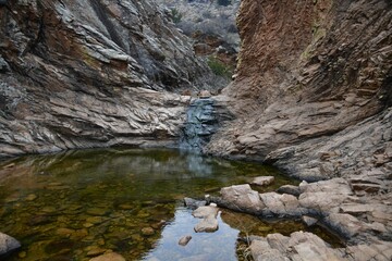 Narrow stream under rocky Wichita Mountains in Oklahoma