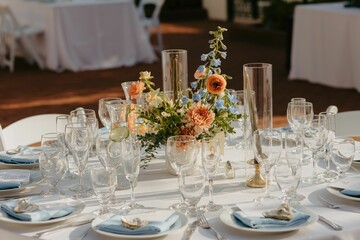 Elegant wedding table setting with flowers and glasses, perfect for a romantic celebration