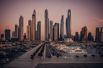 Panoramic view of the evening city with skyscrapers and a beautiful harbor