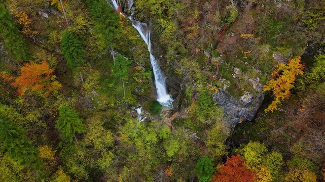 A soteska Pekel waterfall in the autumn, Slovenia, drone video, aerial footage