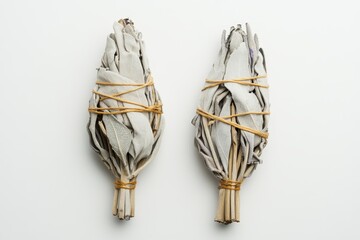 White sage smudge sticks for spiritual use isolated on a white background from two angles top view