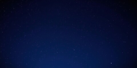 A beautiful and serene photograph of the starry night sky with a vast expanse of stars visible, set against a backdrop of deep blue darkness, stars, universe, nebula