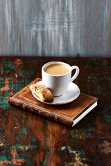 Cup of coffee and Cantuccini (Italian cookie) on dark wooden background. Copy space.