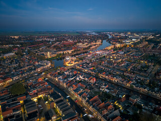 Fototapeta premium Aerial drone image of historic Frisian city of Sneek at night