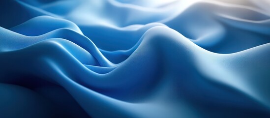 Obraz premium Abstract blue fabric background with soft flowing waves.