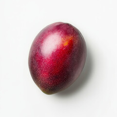 Obraz premium A single fresh mango with visible flesh, isolated on a white background, highlighting its tropical sweetness