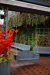 fall garden with a swing and leaves
