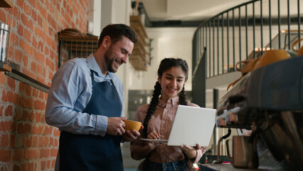 Diverse positive man woman cafeteria employees small business owners cafe manager waiter discussing...