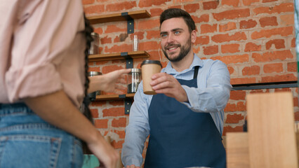 Woman customer pay use contactless payment technology NFC on phone in cafe bar restaurant smiling man waiter barista serving client at counter in cafeteria girl paying through bank mobile app terminal